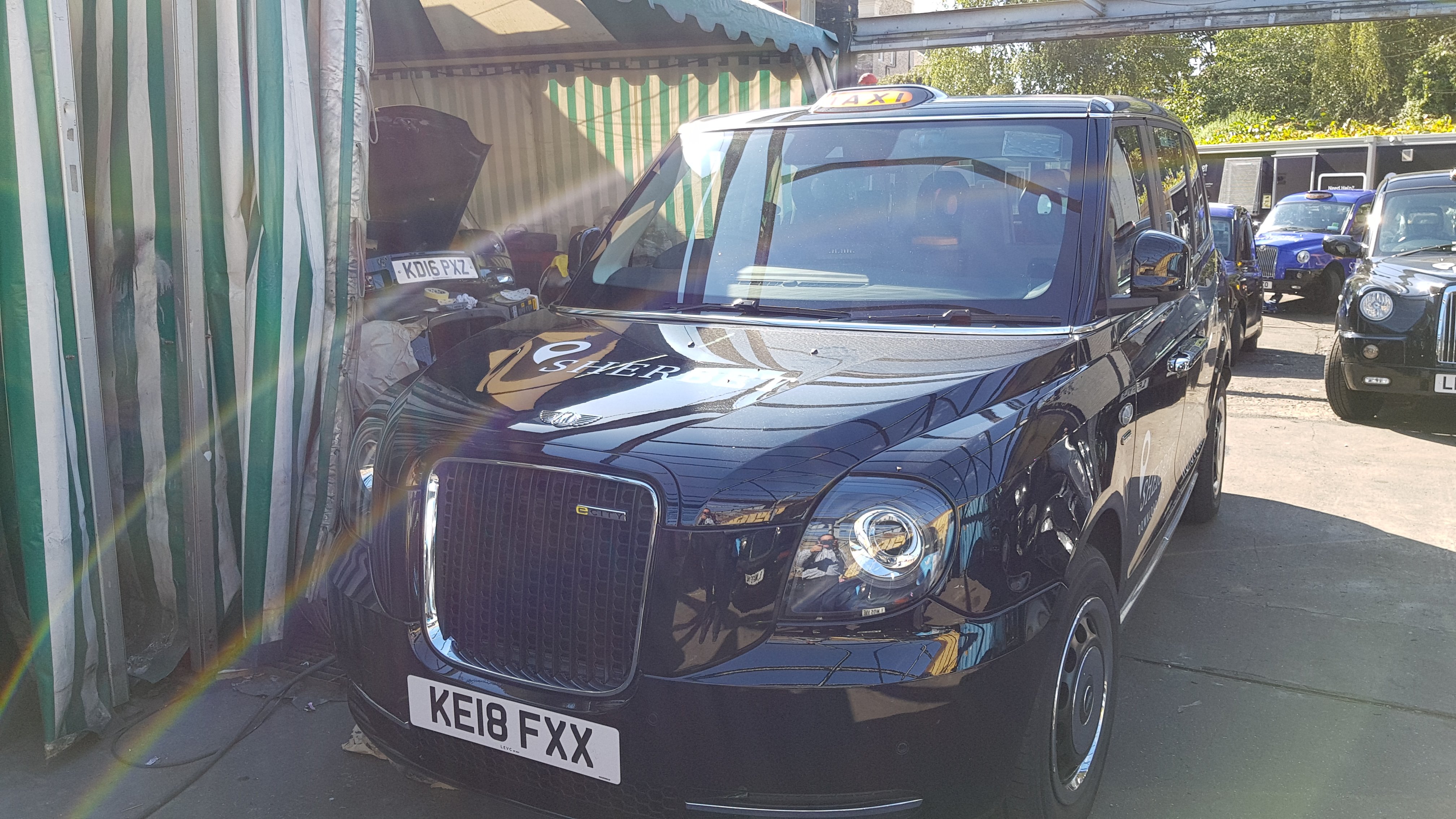 TXE Electric Taxi – LL18 XJD in Sherbet London Office